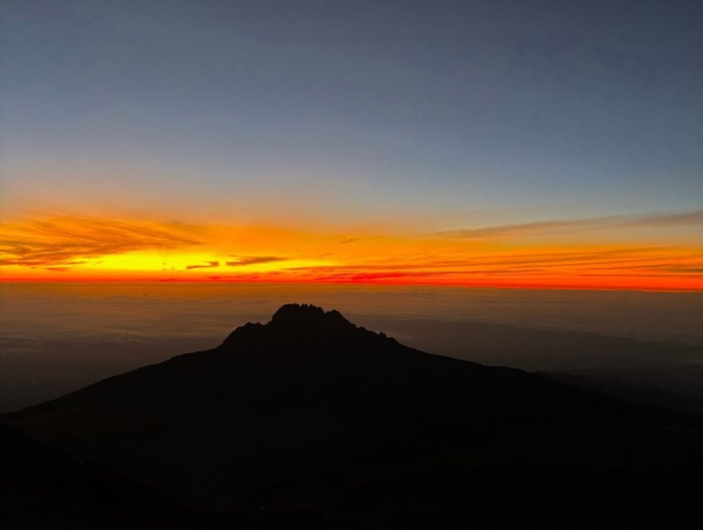 Climbers Enjoying sunrise
