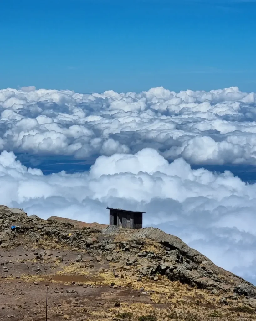 Kilimanjaro mountain rongai route old house cliff clouds