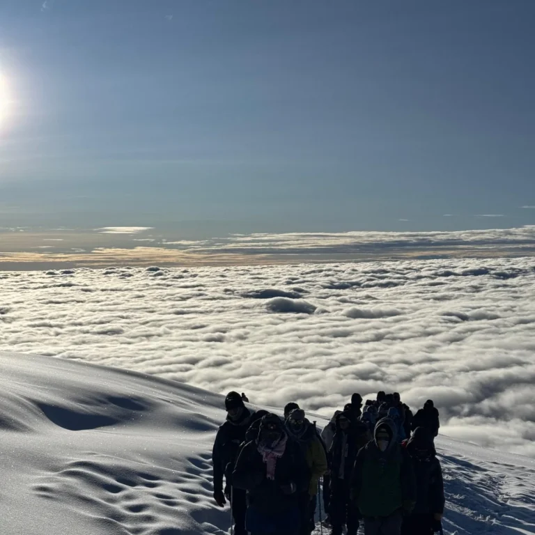 Machame route Kilimanjaro snow people clouds