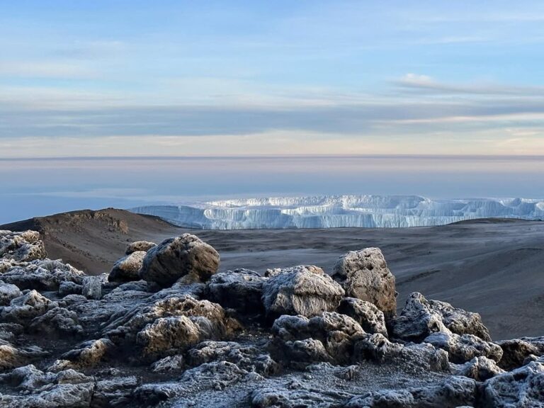 stones, snow and crater view