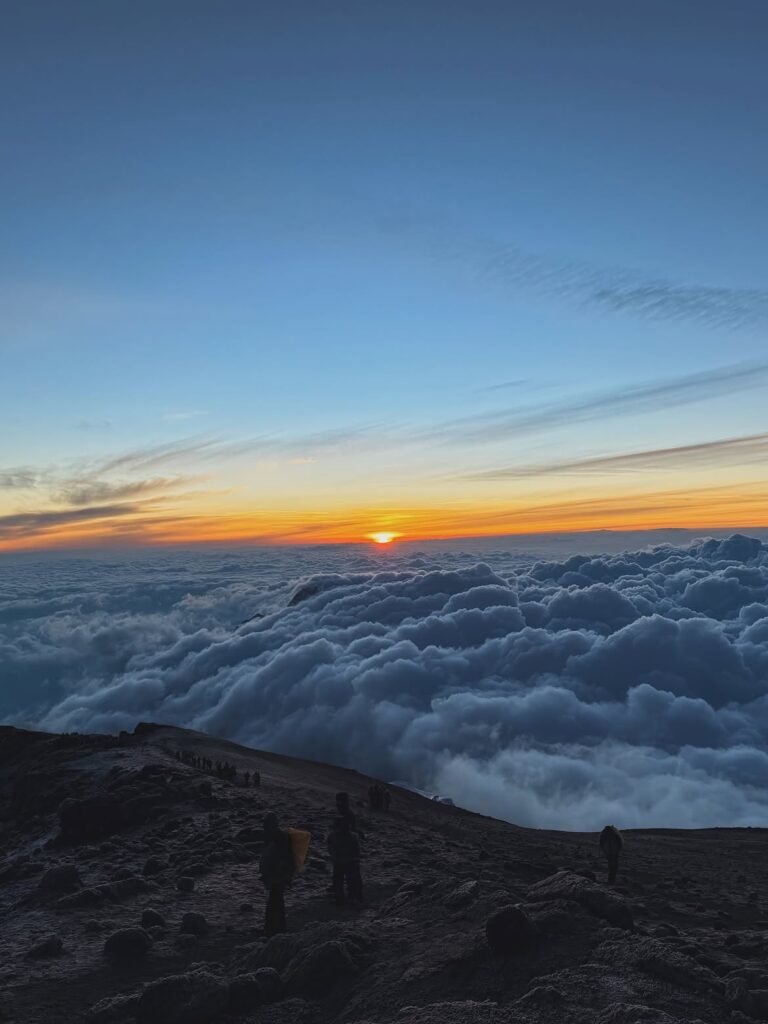 uhuru peak clouds climbers kilimanjaro